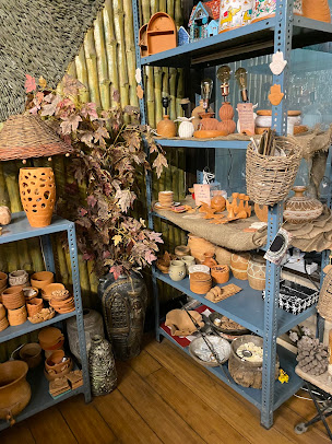 Studio shelves filled with pottery