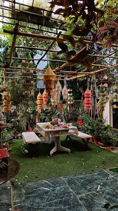 A serene studio space with hanging handcrafted pieces