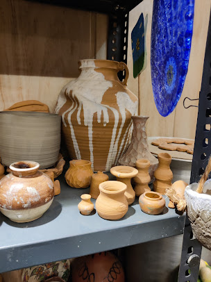 Shelves with handcrafted pottery pieces